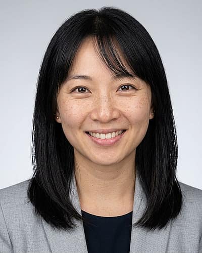 Neutral Gradient / Light Grey · Light gray blazer headshot example