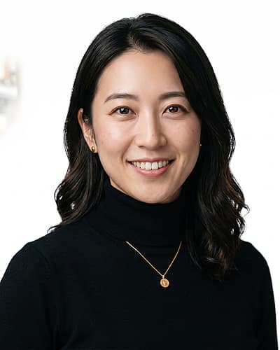 White / Pure White Studio · Fitted black turtleneck headshot example