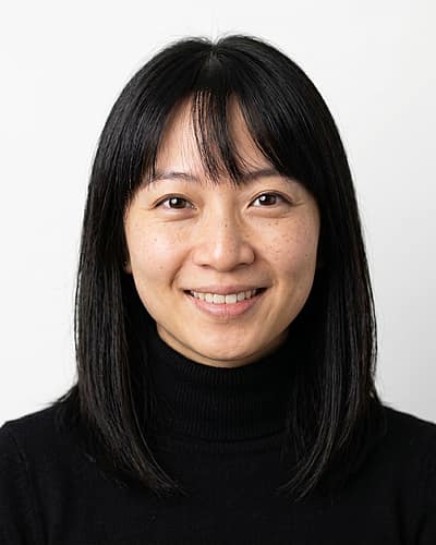 White / Pure White Studio · Fitted black turtleneck headshot example