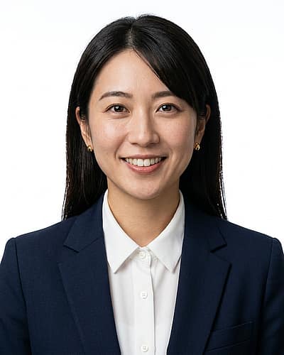 White / Pure White Studio · Navy Blazer, Coral Blouse headshot example