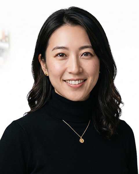 White / Pure White Studio · Fitted black turtleneck headshot example