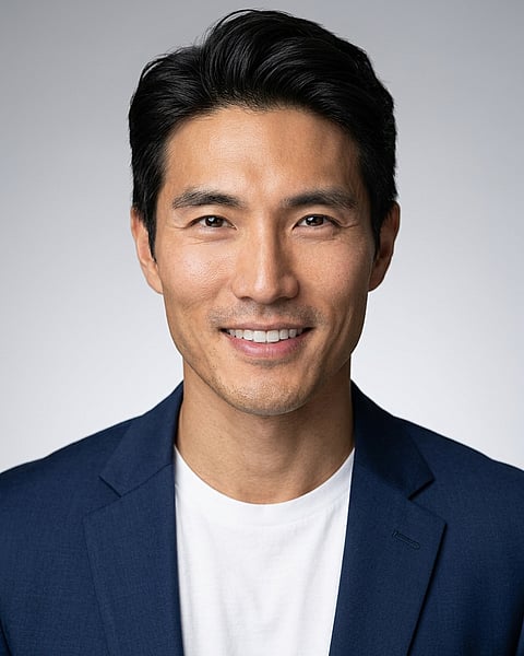 Neutral Gradient / Light Grey · Open navy blazer over simple white tee headshot example