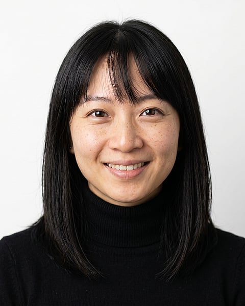 White / Pure White Studio · Fitted black turtleneck headshot example