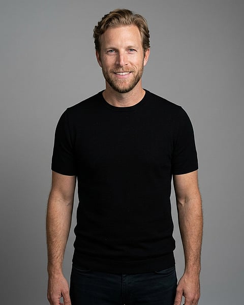Neutral Mid-Grey Gradient Seamless · Dark Button-Up or Simple Black Top headshot example