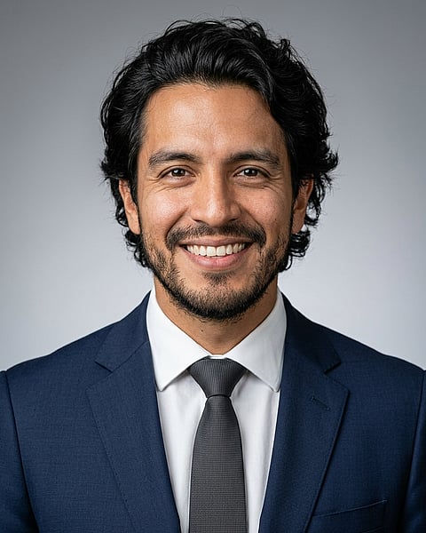 Neutral Gradient / Light Grey · Navy tailored suit headshot example