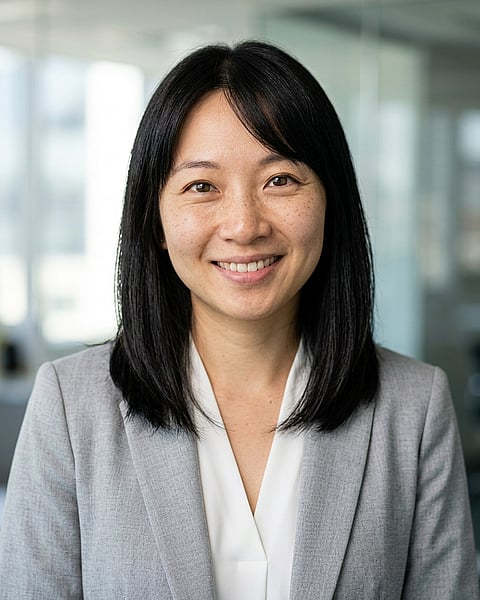 Office / Modern Office Workspace · Light gray blazer headshot example