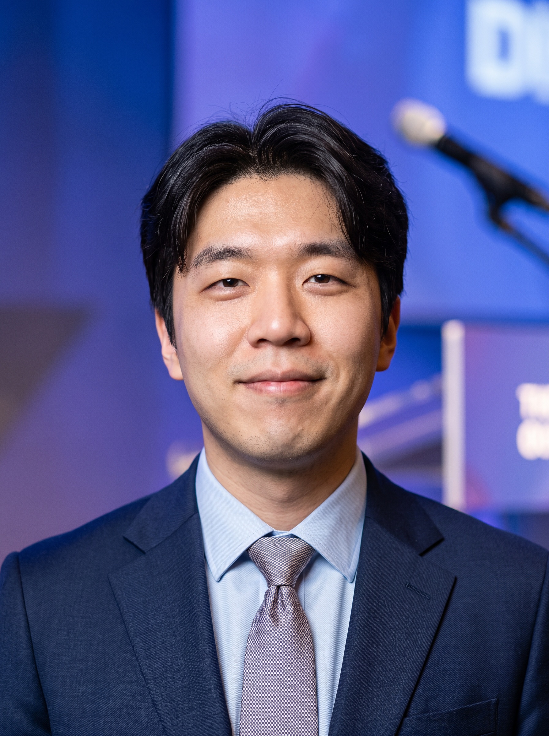 Speaking Stage · Navy Blazer headshot example